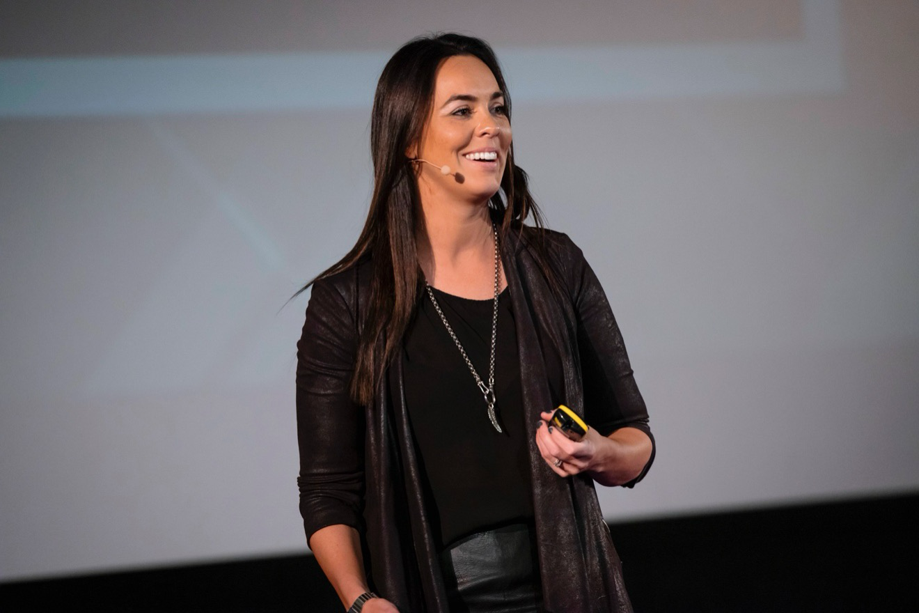 Taisha Fabricius speaking on stage