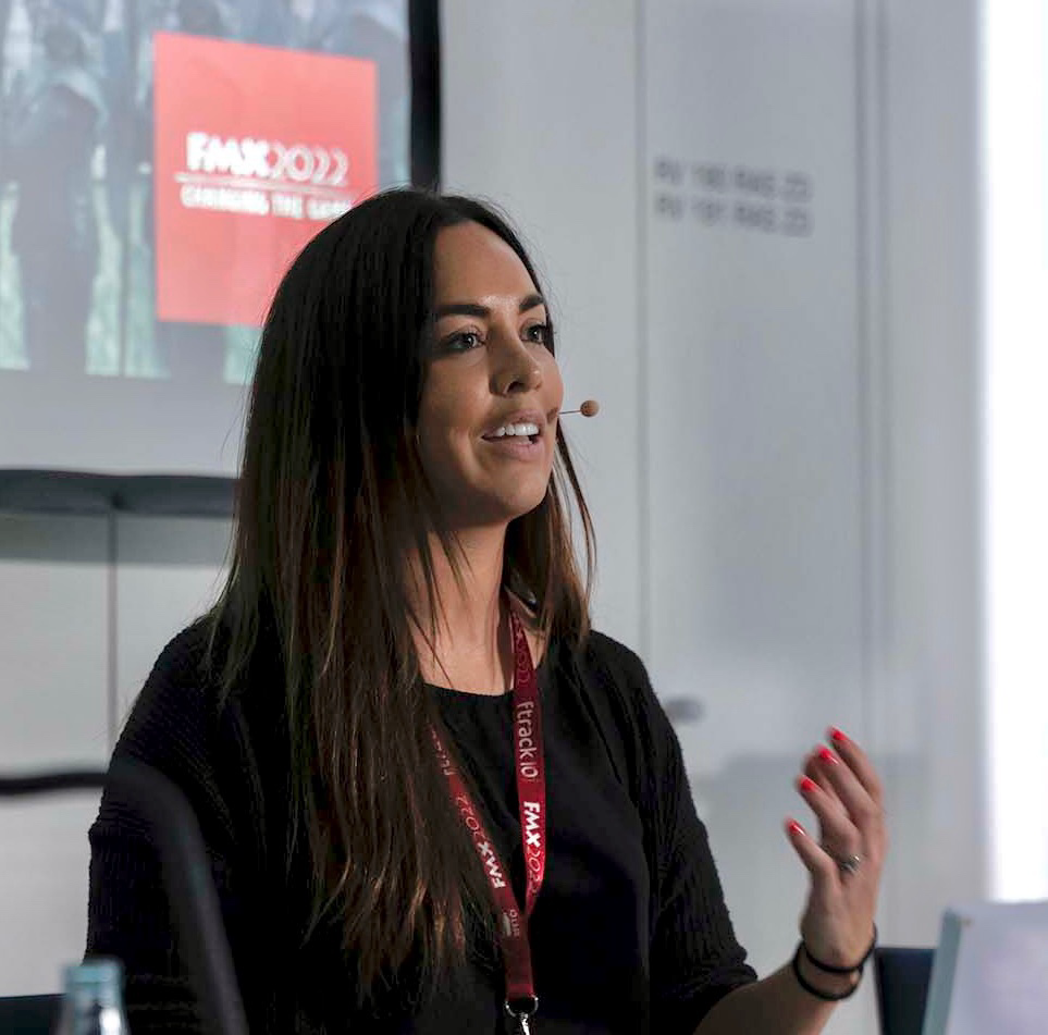 Taisha Fabricius speaking on stage